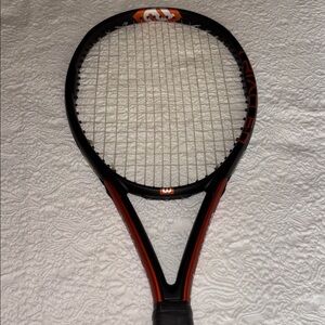 Wilson Black and Burnt Orange Tennis Racket with White Logo